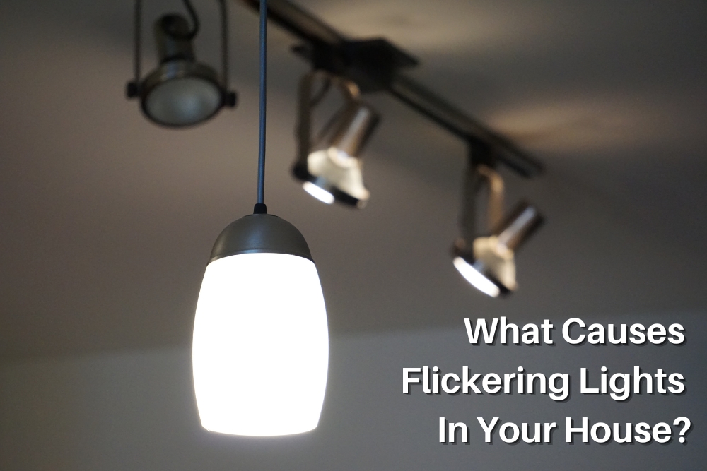 Close-up of a pendant light and track lighting fixtures, illustrating the common issue of flickering lights in households and exploring potential causes and solutions for flickering lights.