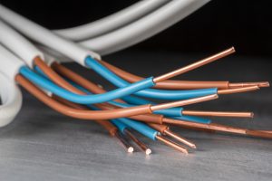 Various coloured copper wires with blue and brown insulation, illustrating the best outdoor cable for electrical installations in the UAE.