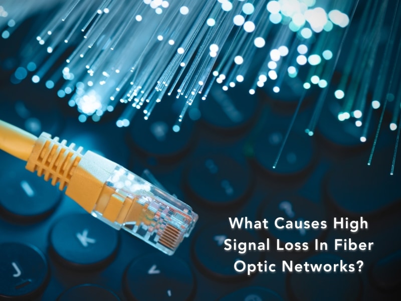 Fiber optic strands with Ethernet cable, illustrating factors like signal loss in fiber optic networks.